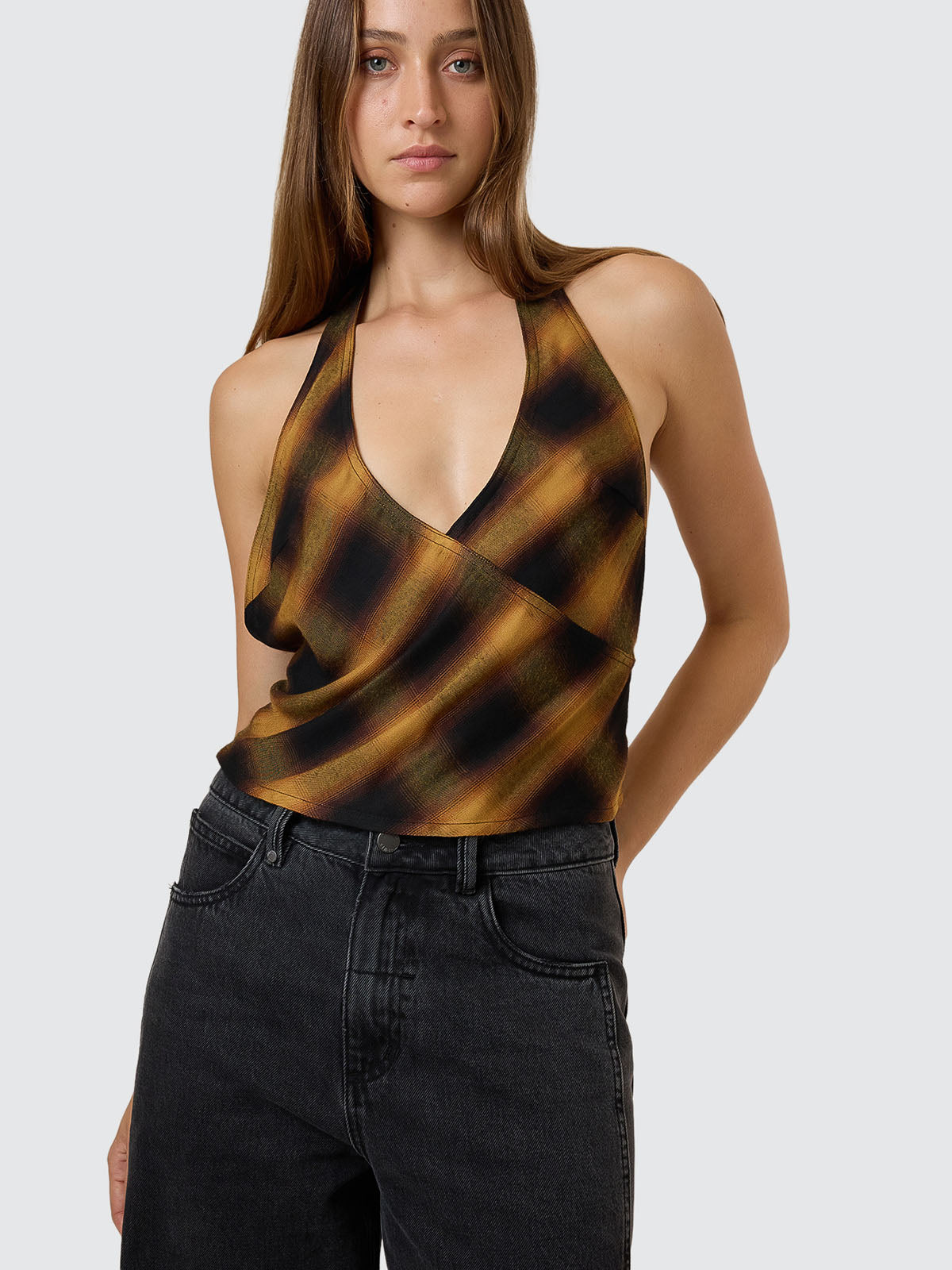 Woman wearing thrills womens top