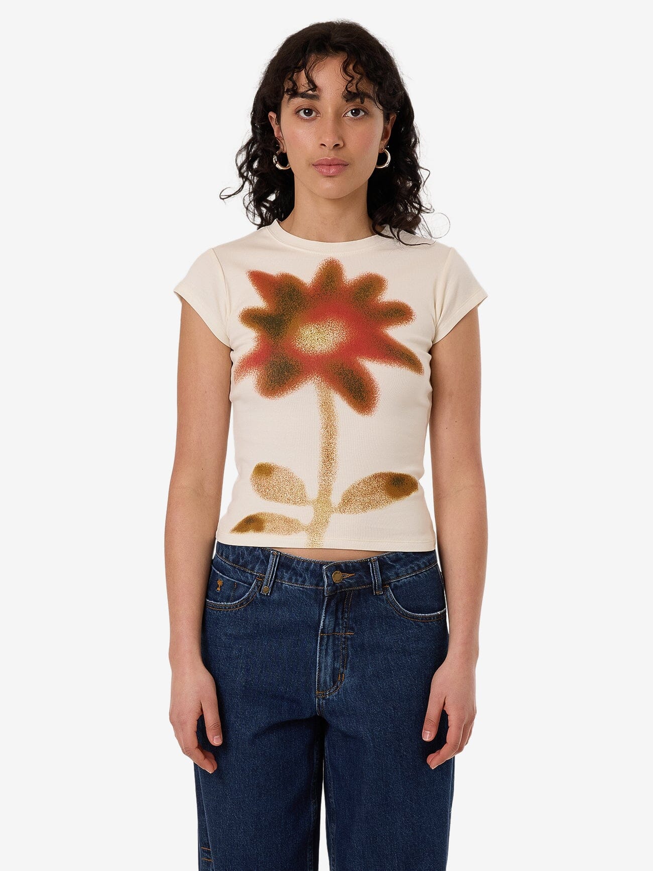 Female model wearing our Thrills standing against a plain studio background.