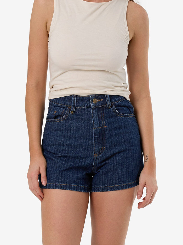 Female model wearing our Thrills Erica Short in Blue standing against a plain studio background.