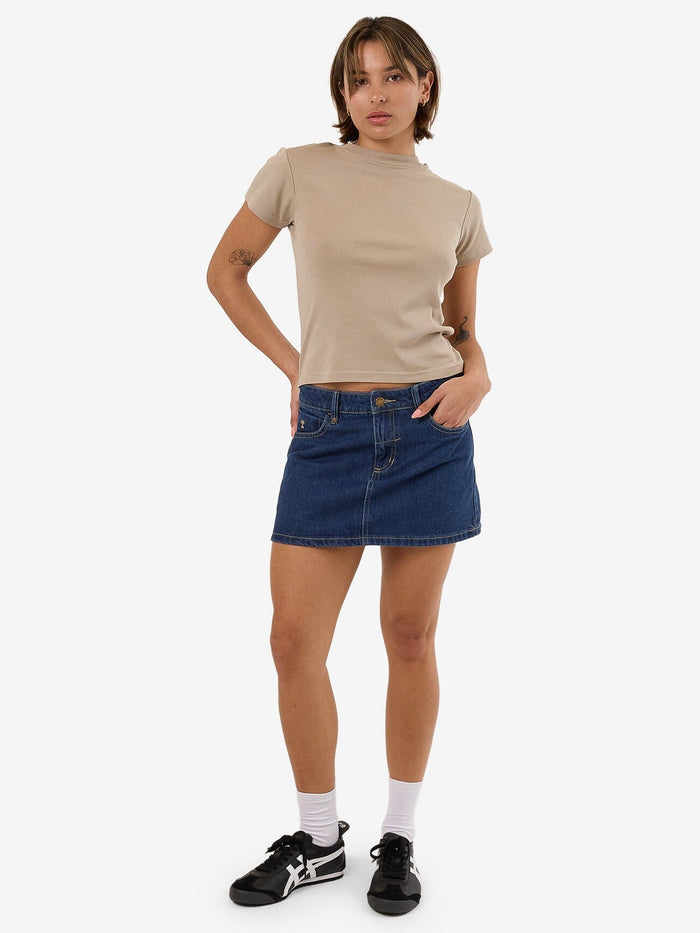 Female model wearing our Thrills Sophie Skirt in Blue standing against a plain studio background.