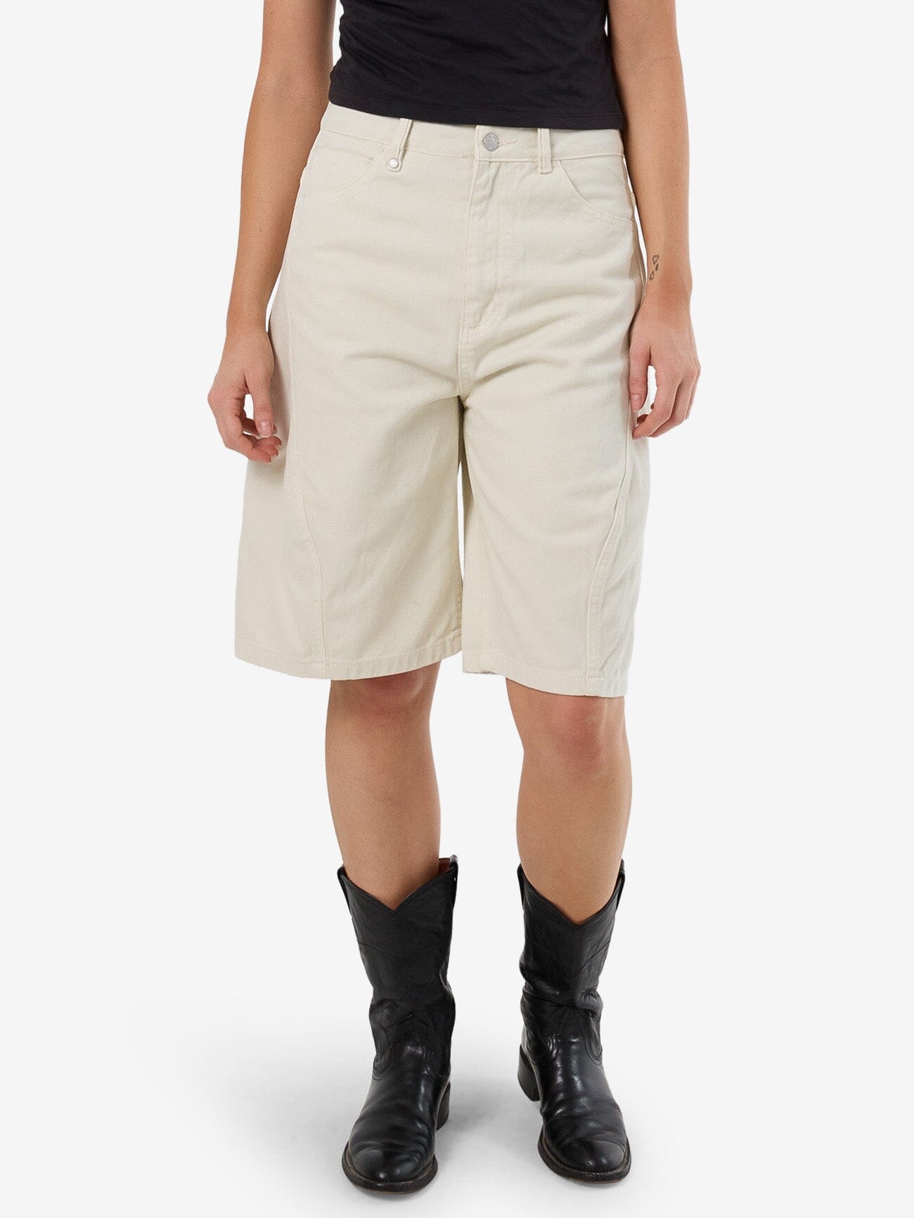 Female model wearing our Thrills Ronnie Short in White standing against a plain studio background.