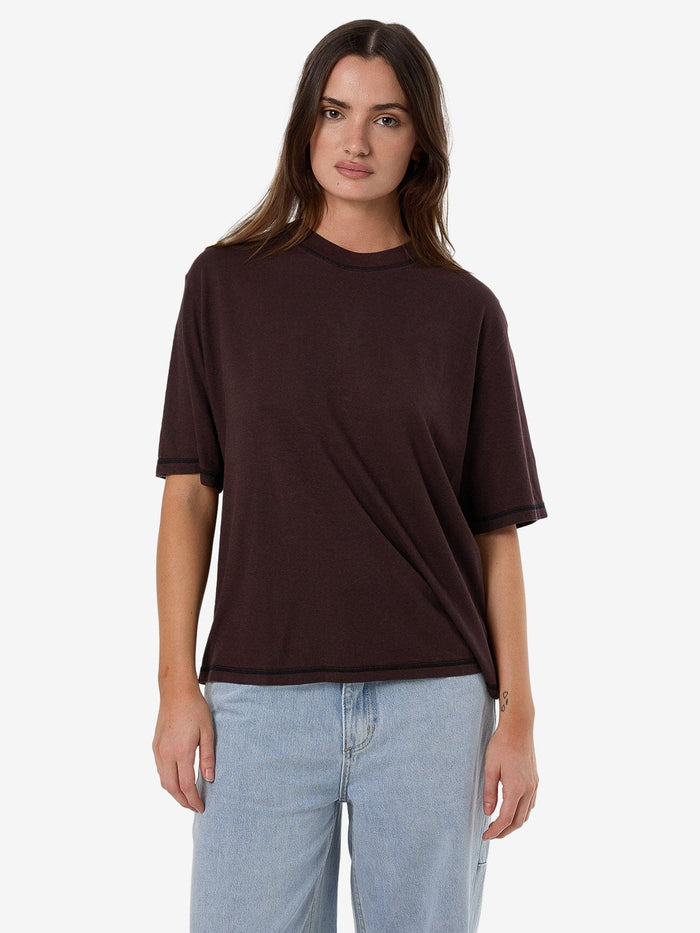 Female model wearing our Thrills Hemp Square Tee in Brown standing against a plain studio background.