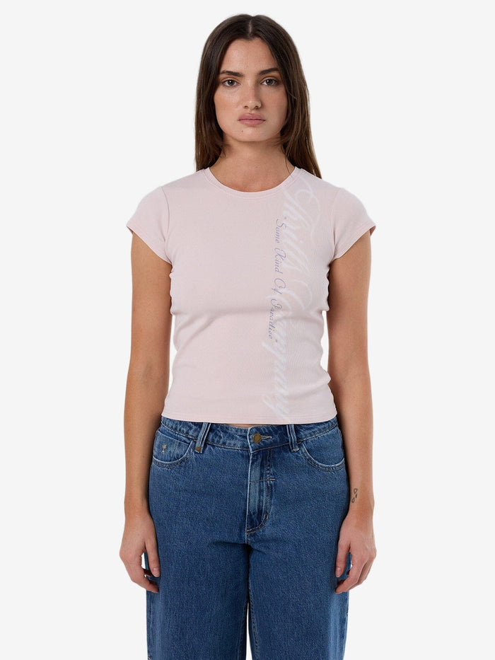 Female model wearing our Thrills Suspended In Time Club Tee in Purple standing against a plain studio background.