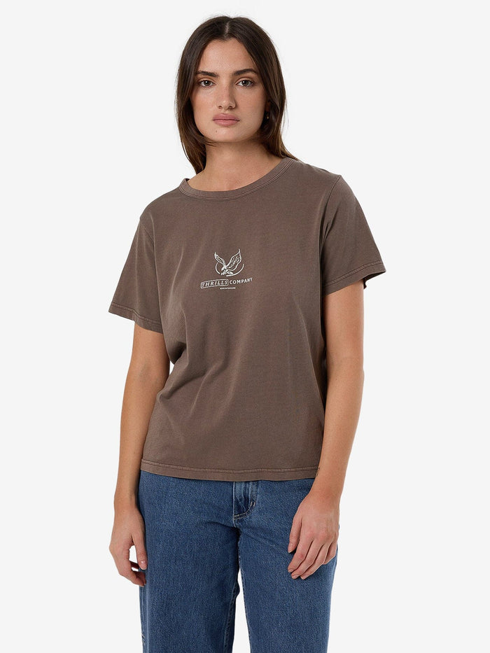 Female model wearing our Thrills Glory Relaxed Tee in Brown standing against a plain studio background.
