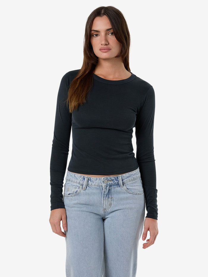 Female model wearing our Thrills Ryden Micro Rib Top in Grey standing against a plain studio background.