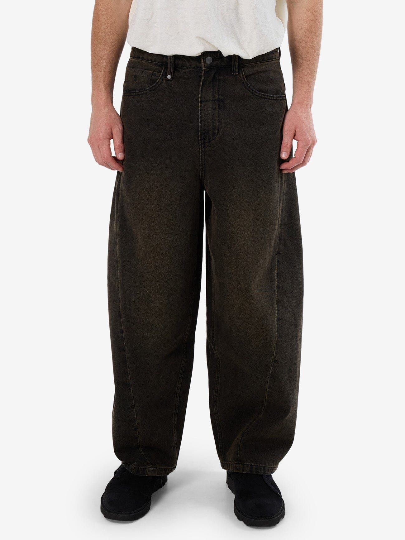 Male model wearing our Thrills Barrel Leg Denim Jean in Black standing against a plain studio background.