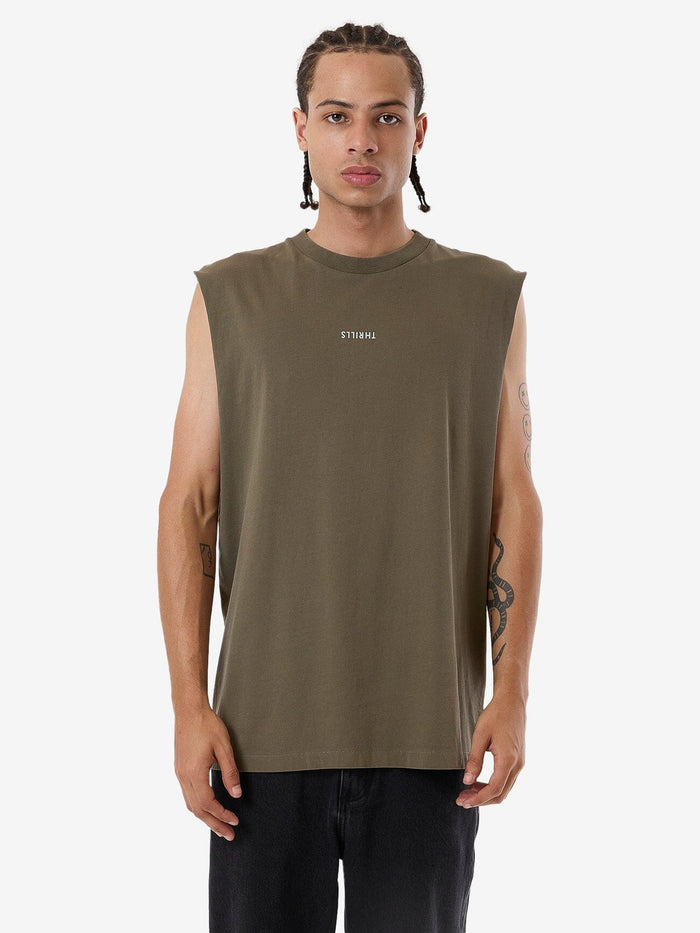 Male model wearing our Thrills Minimal Thrills Merch Fit Muscle Tee in Green standing against a plain studio background.