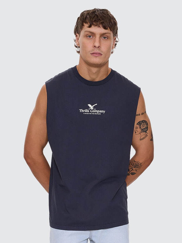 Man wearing a navy sleeveless shirt with a logo on a white background