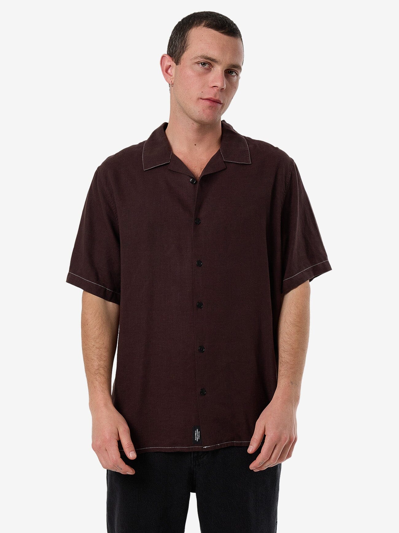 Male model wearing our Thrills Hemp Minimal Thrills Contrast Stitch Bowling Shirt in Brown standing against a plain studio background.
