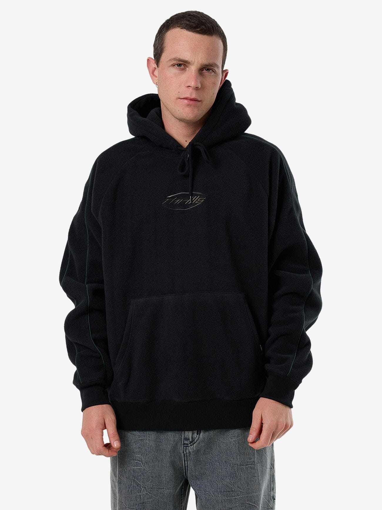 Male model wearing our Thrills Fortune Favors Raglan Panel Hood in Black standing against a plain studio background.