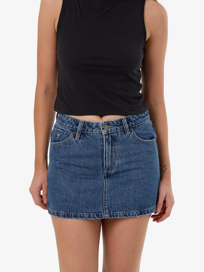 Female model wearing our Thrills Sophie Skirt in Blue standing against a plain studio background.