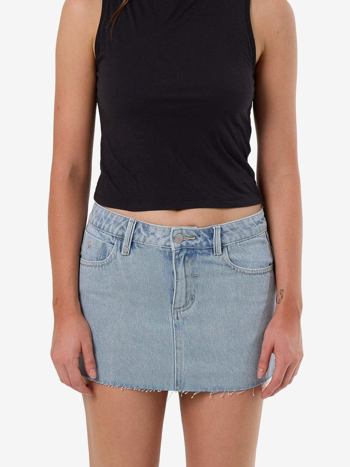 Female model wearing our Thrills Carmen Skirt in Blue standing against a plain studio background.