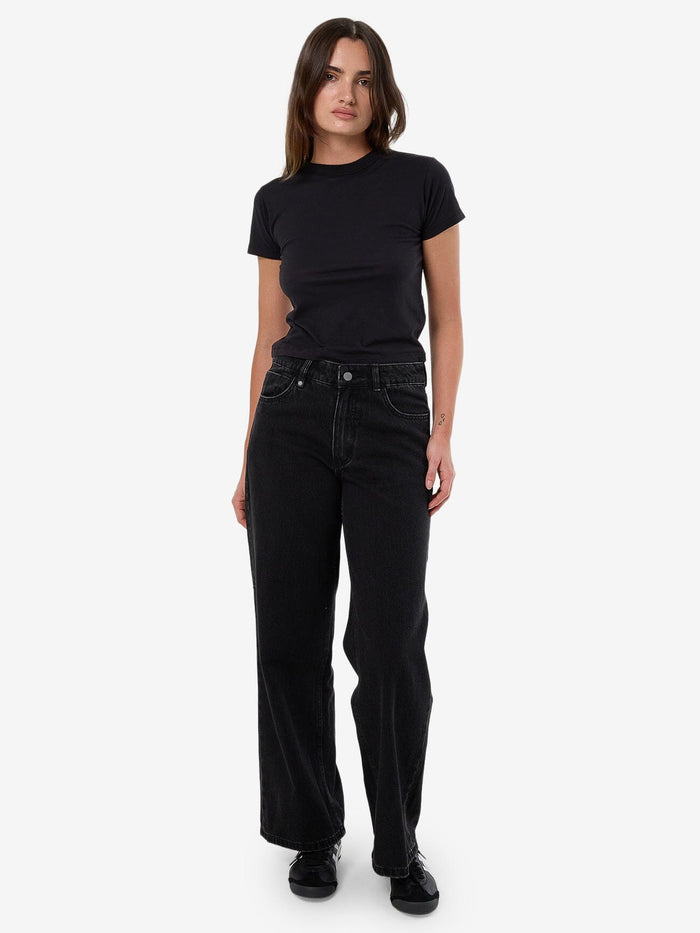 Female model wearing our Thrills Billie Low Jean in Black standing against a plain studio background.