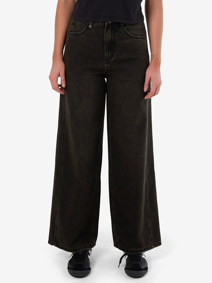 Female model wearing our Thrills Ashton Jean in Black standing against a plain studio background.