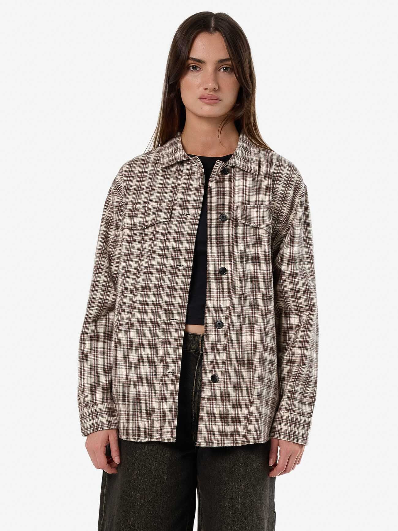 Female model wearing our Thrills Adorned Check Over Shirt in Brown standing against a plain studio background.