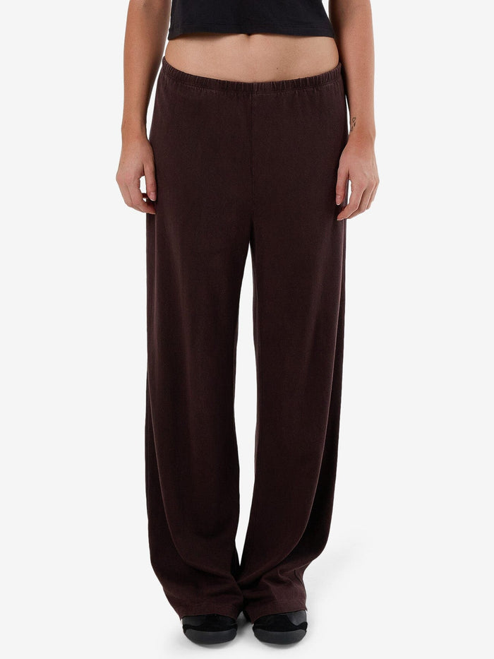 Female model wearing our Thrills Hemp Relax Pant in Brown standing against a plain studio background.