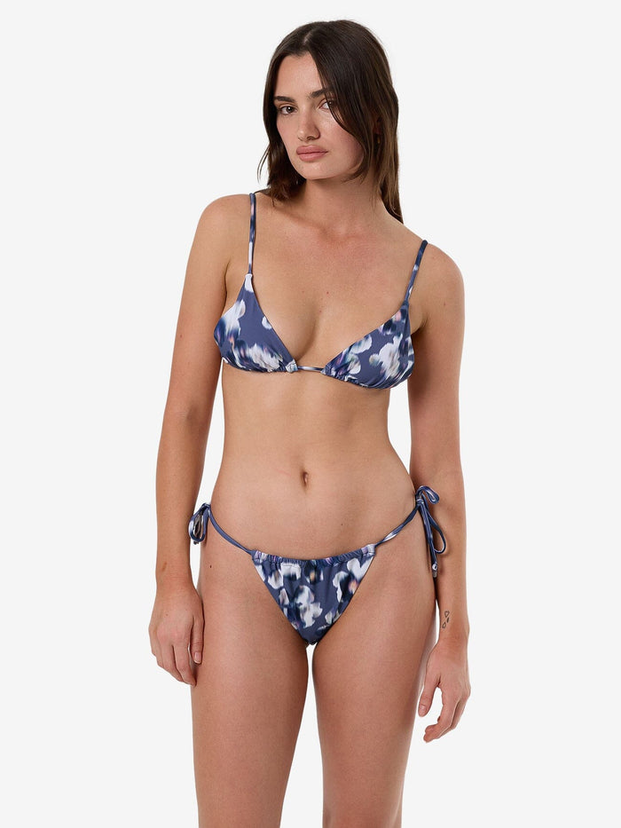 Female model wearing our Thrills Cyber Bloom Slide Tri Top in Purple standing against a plain studio background.